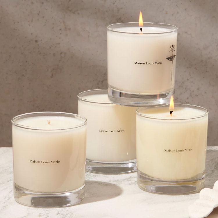 improve-mood-luxury-home-scents-Maison-Louis-Marie-Bois-de-Balincourt-Candle Four stacked Maison Louis Marie No.04 Bois de Balincourt candles.