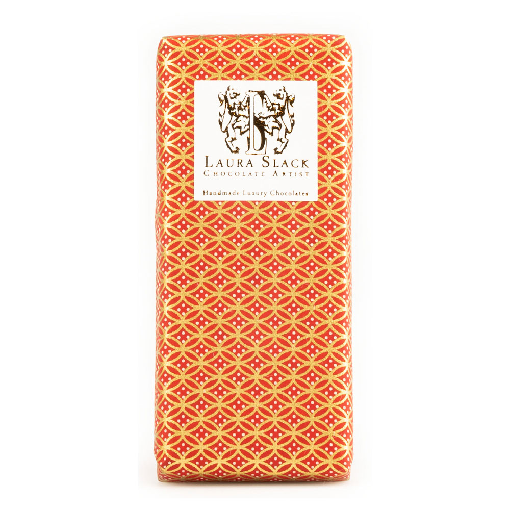 An orange-flavoured chocolate bar is wrapped with decorative embossed paper