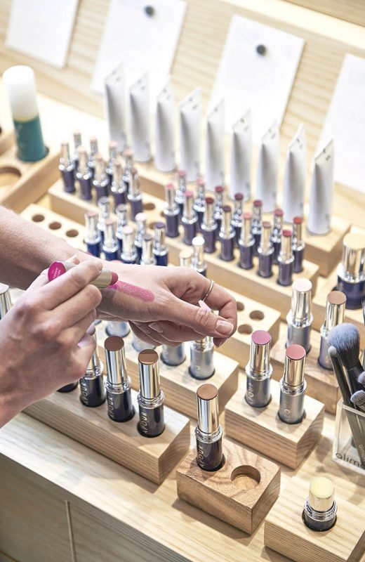 Shopper testing natural cosmetics at The Detox Market