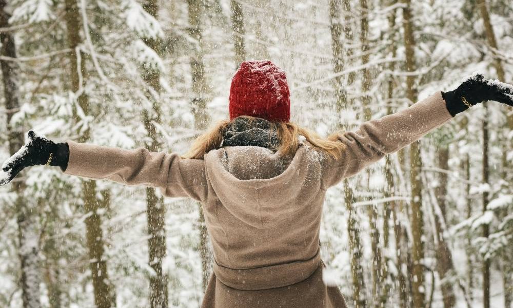 happy woman in winter wonderland