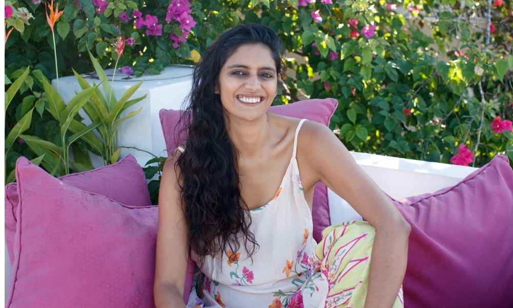 author-sitting-in-lush-garden