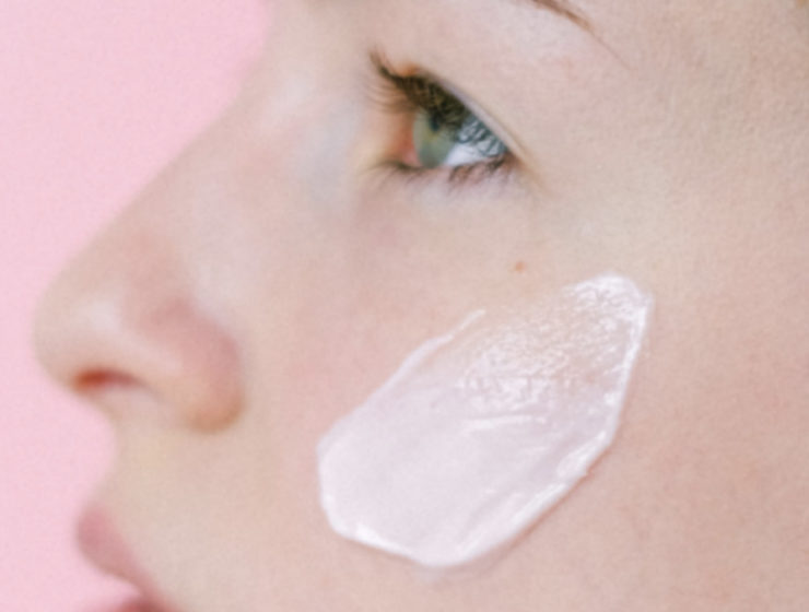 whte-woman-smearing-cleanser-on-cheek