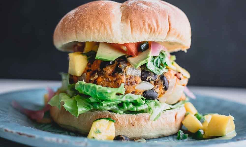 A hearty veggie burger with a patty that's made with chunks of vegetables