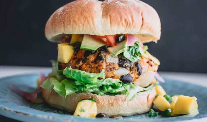 A hearty veggie burger with a patty that's made with chunks of vegetables