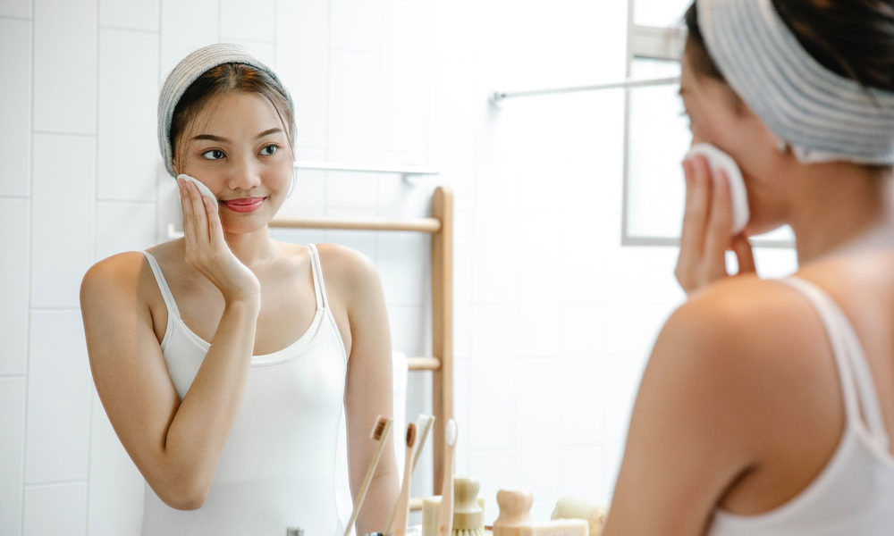 A woman washing her face