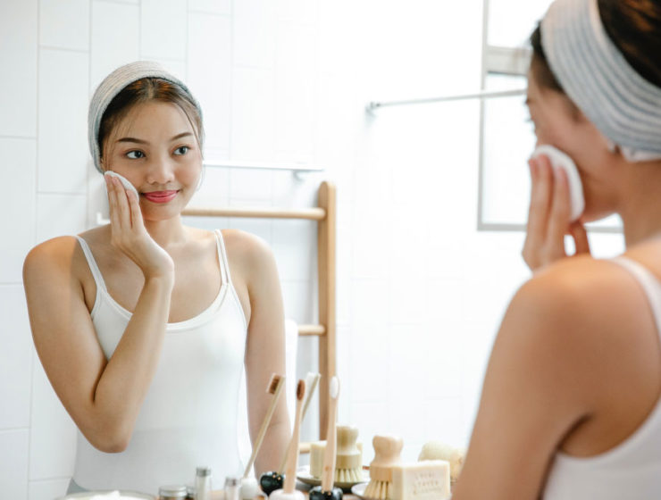 A woman washing her face