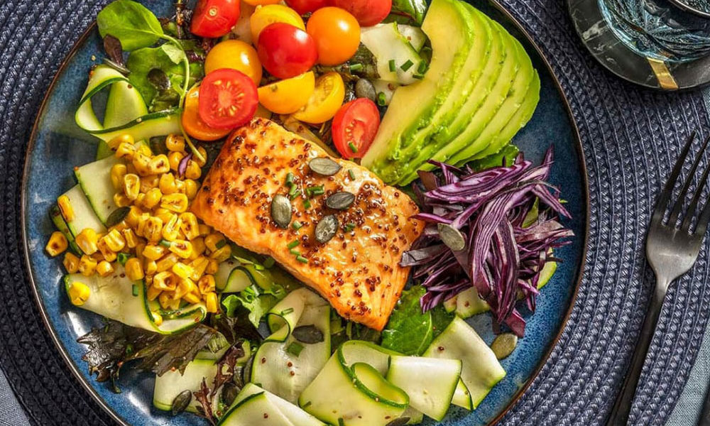 A plate of varied flavours and textures, with the salmon in the centre as the feature.