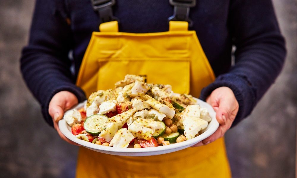 man-holding-fish-salad
