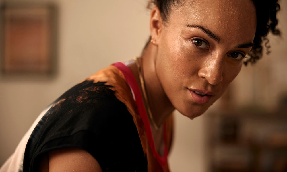 Peloton Guide Review: image features a woman who just worked out.