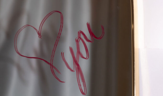 "Love you" on a mirror, as the answer to why dating is so hard.