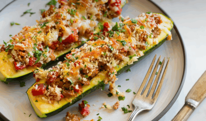 Two stuffed zucchini boats.