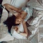 Canadian woman looking rested after spending a day in bed nursing a viral illness.